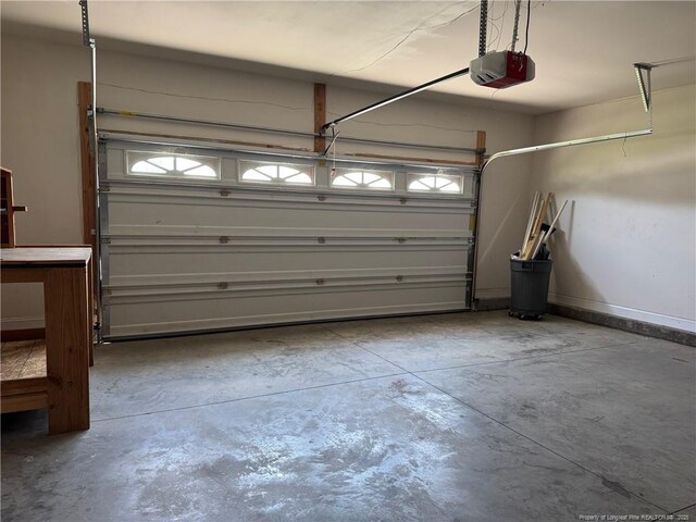 1545 Gallant Fox Ct, Parkton, NC 28371 - garage with a garage door opener and baseboards