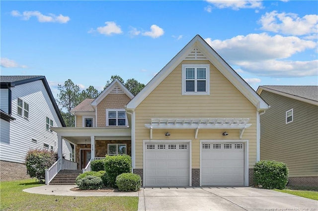 716 Micahs Way N, Spring Lake, NC 28390 - view of front facade featuring driveway, covered porch, a garage, and brick siding