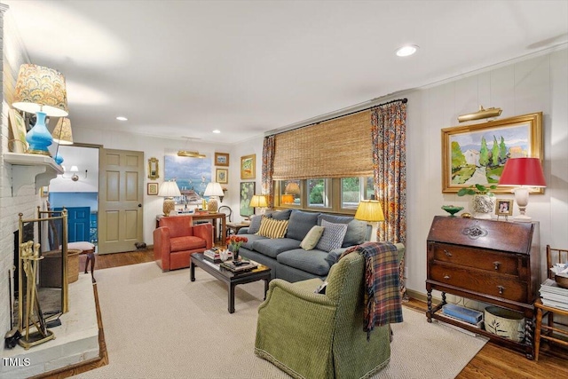 3308 Cobblestone Ct, Raleigh, NC 27607 - living room with wood finished floors, recessed lighting, ornamental molding, and a fireplace