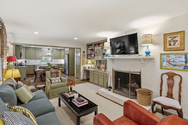 3308 Cobblestone Ct, Raleigh, NC 27607 - living room featuring recessed lighting and a brick fireplace