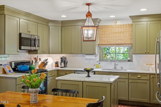 3308 Cobblestone Ct, Raleigh, NC 27607 - kitchen with stainless steel microwave, range, a sink, and green cabinets
