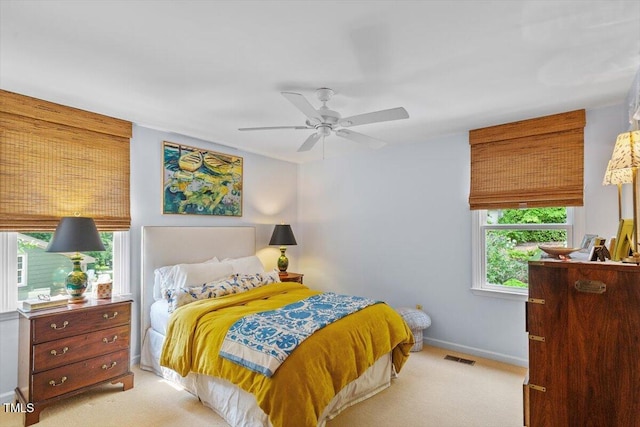 3308 Cobblestone Ct, Raleigh, NC 27607 - bedroom with light carpet, baseboards, and ceiling fan