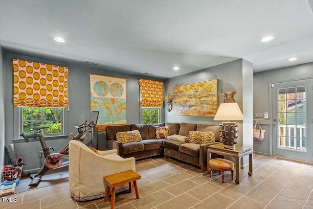 3308 Cobblestone Ct, Raleigh, NC 27607 - tiled living room with recessed lighting