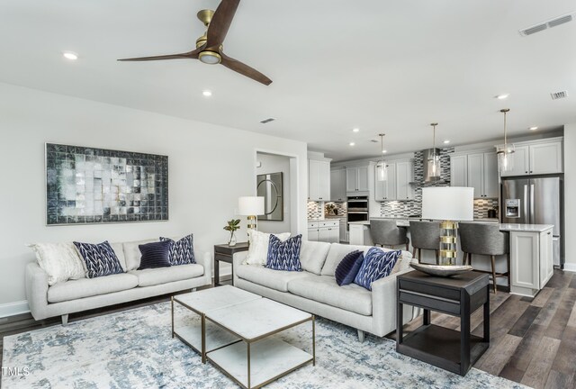 2516 Del Webb Gardens Dr, Fuquay Varina, NC 27526 - living area with recessed lighting, ceiling fan, dark wood finished floors, and baseboards