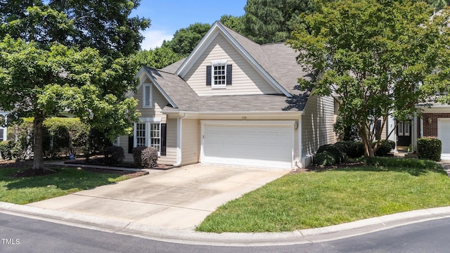 206 Lake Brandt Dr, Cary, NC 27519 - view of front of property featuring a garage, driveway, a front yard, and a shingled roof