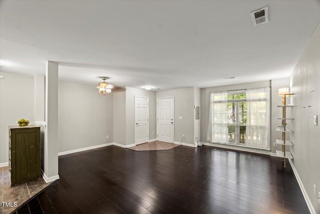 2920 Barrymore St Unit 106, Raleigh, NC 27603 - unfurnished living room with wood finished floors and a chandelier