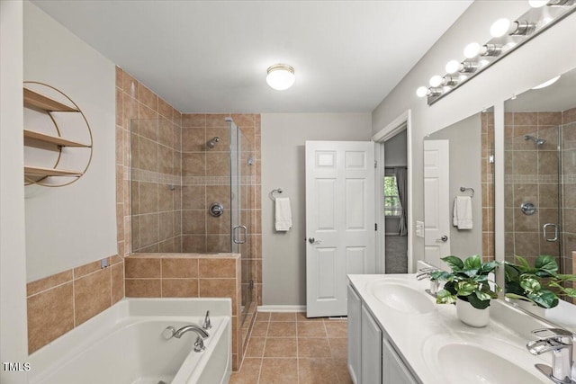 2920 Barrymore St Unit 106, Raleigh, NC 27603 - bathroom with a shower stall, a bath, tile patterned floors, and double vanity
