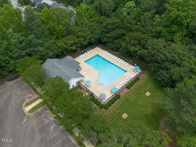 2920 Barrymore St Unit 106, Raleigh, NC 27603 - drone / aerial view of a pool area and a forest