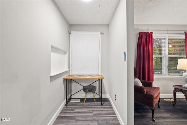 9801 Honeycutt Rd, Raleigh, NC 27614 - corridor featuring wood finished floors, baseboards, and a textured ceiling
