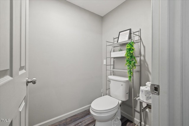 9801 Honeycutt Rd, Raleigh, NC 27614 - bathroom featuring toilet, wood finished floors, and baseboards
