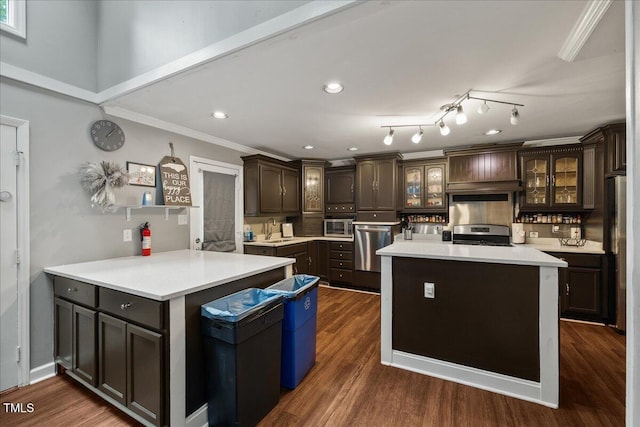 9801 Honeycutt Rd, Raleigh, NC 27614 - kitchen featuring stainless steel appliances, a sink, a peninsula, light countertops, and ornamental molding