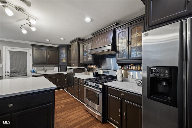 9801 Honeycutt Rd, Raleigh, NC 27614 - kitchen with appliances with stainless steel finishes, custom exhaust hood, a sink, glass insert cabinets, and ornamental molding
