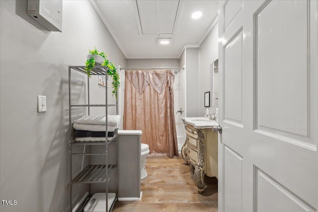 9801 Honeycutt Rd, Raleigh, NC 27614 - full bath featuring toilet, wood finished floors, vanity, recessed lighting, and shower / tub combo with curtain