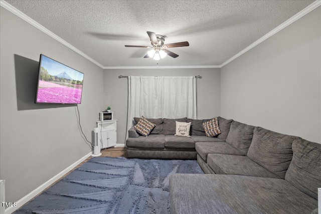 9801 Honeycutt Rd, Raleigh, NC 27614 - living room featuring ceiling fan, a textured ceiling, ornamental molding, and baseboards