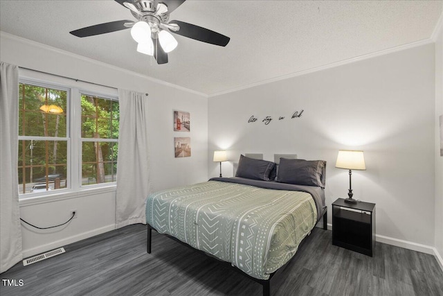 9801 Honeycutt Rd, Raleigh, NC 27614 - bedroom featuring wood finished floors, baseboards, crown molding, a ceiling fan, and a textured ceiling