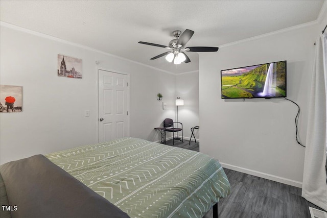 9801 Honeycutt Rd, Raleigh, NC 27614 - bedroom with dark wood-style flooring, crown molding, baseboards, and ceiling fan