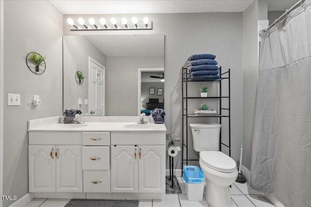 9801 Honeycutt Rd, Raleigh, NC 27614 - bathroom with double vanity, toilet, tile patterned floors, a shower with curtain, and baseboards