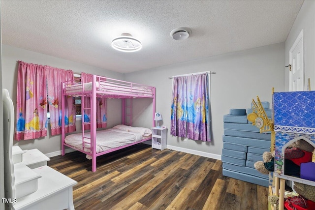 9801 Honeycutt Rd, Raleigh, NC 27614 - bedroom featuring wood finished floors, baseboards, and a textured ceiling