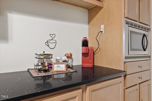 9801 Honeycutt Rd, Raleigh, NC 27614 - kitchen featuring stainless steel microwave and dark stone counters