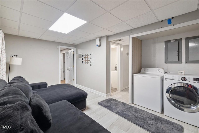 9801 Honeycutt Rd, Raleigh, NC 27614 - laundry room with independent washer and dryer, electric panel, light wood-style flooring, and baseboards