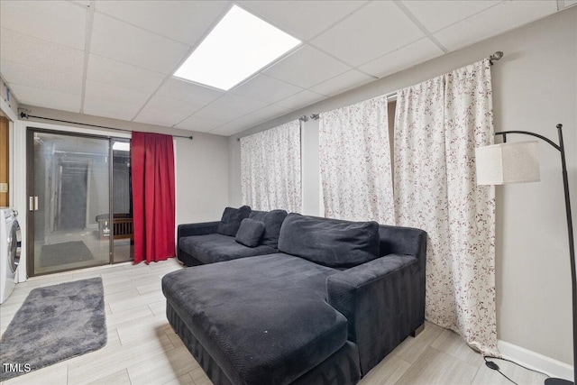 9801 Honeycutt Rd, Raleigh, NC 27614 - living room featuring washer / dryer, a drop ceiling, and baseboards