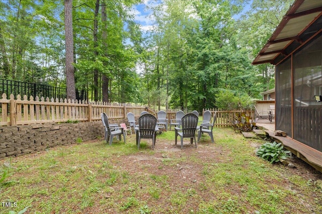 9801 Honeycutt Rd, Raleigh, NC 27614 - fenced backyard featuring a sunroom and view of scattered trees