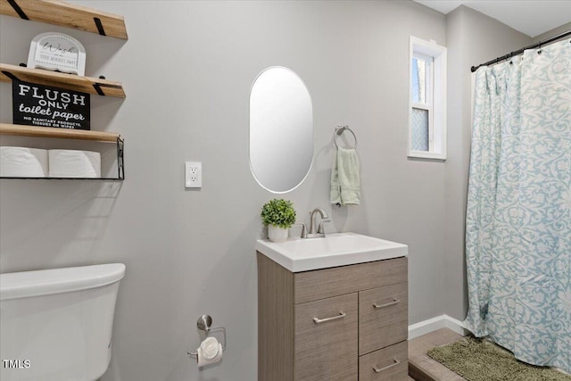 9801 Honeycutt Rd, Raleigh, NC 27614 - bathroom featuring vanity, toilet, baseboards, and a shower with curtain