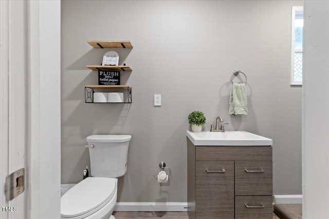 9801 Honeycutt Rd, Raleigh, NC 27614 - half bath featuring toilet, vanity, and baseboards