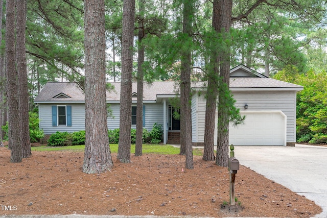 502 Hillcrest Rd, Apex, NC 27502 - view of front of house featuring a garage, driveway, and a shingled roof