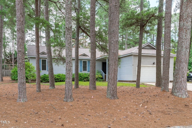 502 Hillcrest Rd, Apex, NC 27502 - view of front of house with a garage and roof with shingles