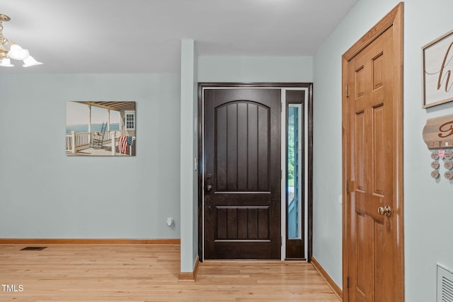 502 Hillcrest Rd, Apex, NC 27502 - entryway featuring light wood finished floors and a chandelier