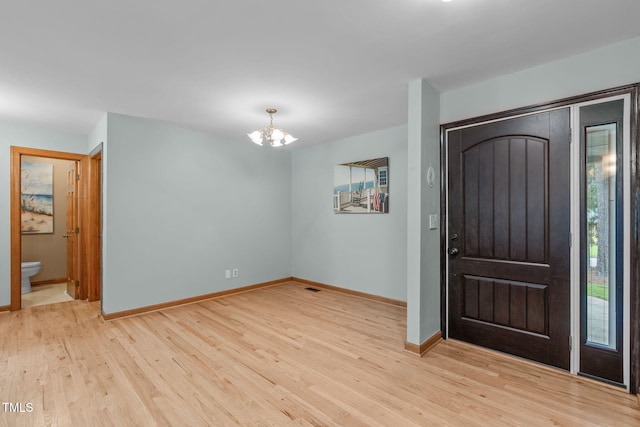 502 Hillcrest Rd, Apex, NC 27502 - foyer entrance with a chandelier and light wood-type flooring