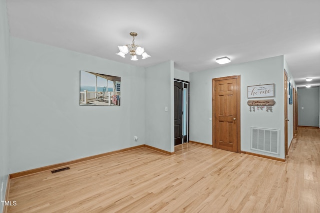 502 Hillcrest Rd, Apex, NC 27502 - unfurnished room featuring a chandelier and wood finished floors