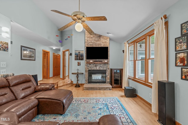 502 Hillcrest Rd, Apex, NC 27502 - living room featuring lofted ceiling, wood finished floors, a ceiling fan, and a fireplace