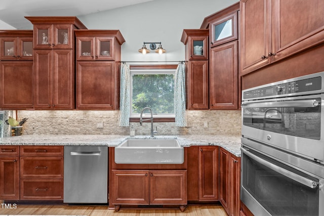 502 Hillcrest Rd, Apex, NC 27502 - kitchen featuring stainless steel appliances, tasteful backsplash, and light stone counters