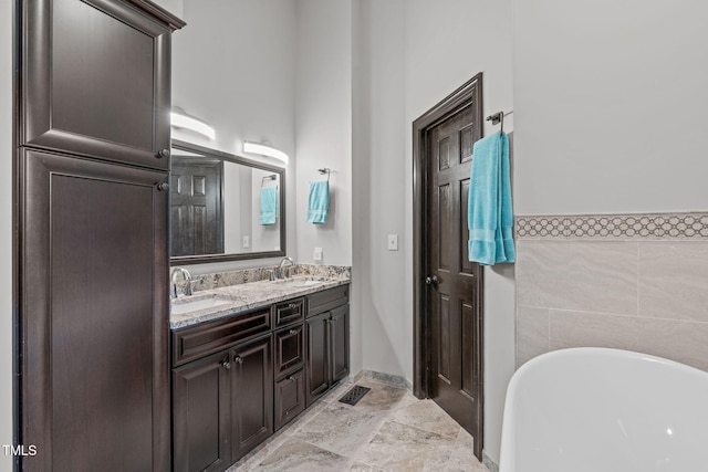 502 Hillcrest Rd, Apex, NC 27502 - full bathroom featuring a soaking tub and double vanity