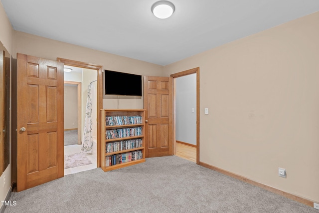 502 Hillcrest Rd, Apex, NC 27502 - carpeted bedroom featuring baseboards