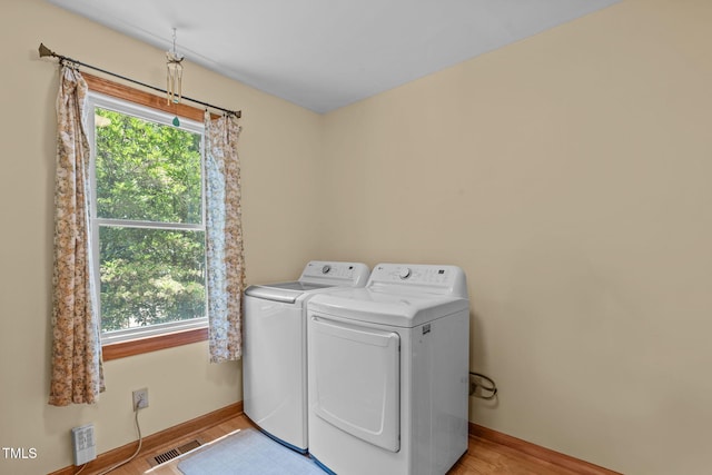 502 Hillcrest Rd, Apex, NC 27502 - laundry room with separate washer and dryer and light wood finished floors