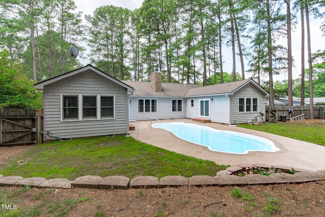 502 Hillcrest Rd, Apex, NC 27502 - rear view of property with a chimney, a patio area, a fenced backyard, and a gate