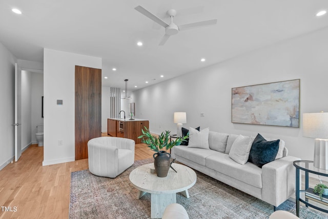 511 S Bloodworth St Unit 104, Raleigh, NC 27601 - living area with light wood finished floors, recessed lighting, a ceiling fan, and baseboards