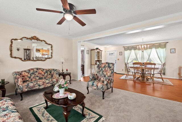 4403 Jeffries Rd, Durham, NC 27704 - carpeted living area with ornamental molding, ceiling fan, a chandelier, a textured ceiling, and baseboards