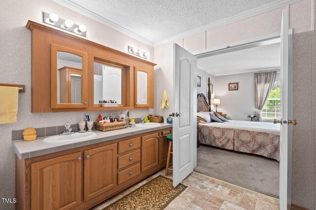 4403 Jeffries Rd, Durham, NC 27704 - ensuite bathroom with ornamental molding, double vanity, and a textured ceiling