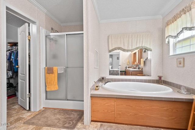 4403 Jeffries Rd, Durham, NC 27704 - bathroom featuring a shower stall, ornamental molding, a garden tub, a spacious closet, and a textured ceiling