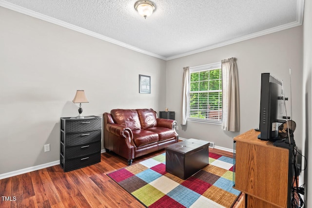 4403 Jeffries Rd, Durham, NC 27704 - living room with wood finished floors, crown molding, a textured ceiling, and baseboards