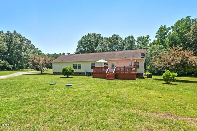 4403 Jeffries Rd, Durham, NC 27704 - rear view of house with crawl space, a wooden deck, and a lawn