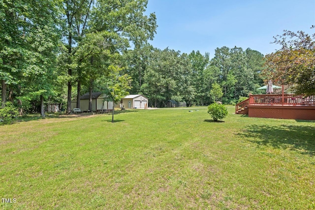 4403 Jeffries Rd, Durham, NC 27704 - view of grassy yard with a wooden deck