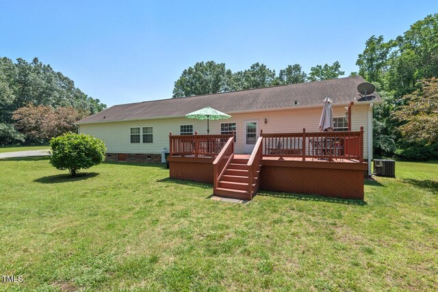 4403 Jeffries Rd, Durham, NC 27704 - rear view of property with central AC unit, a deck, and a yard