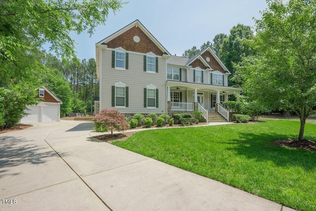 1005 Hidden River Ct, Raleigh, NC 27614 - view of front of home featuring a porch, an outdoor structure, a front lawn, and a garage