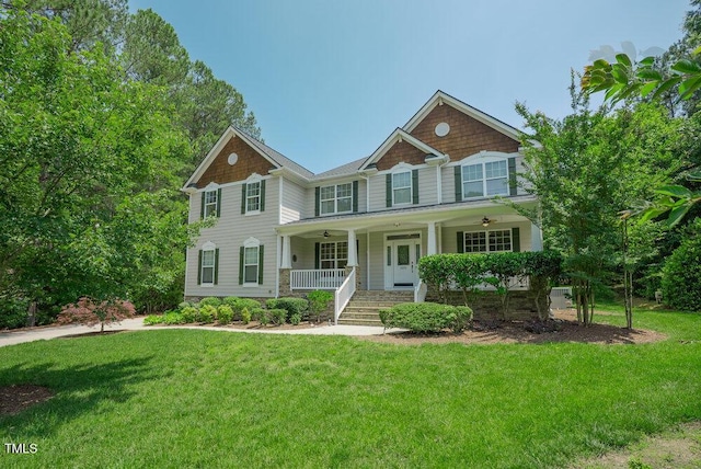 1005 Hidden River Ct, Raleigh, NC 27614 - view of front facade featuring ceiling fan, a porch, and a front lawn
