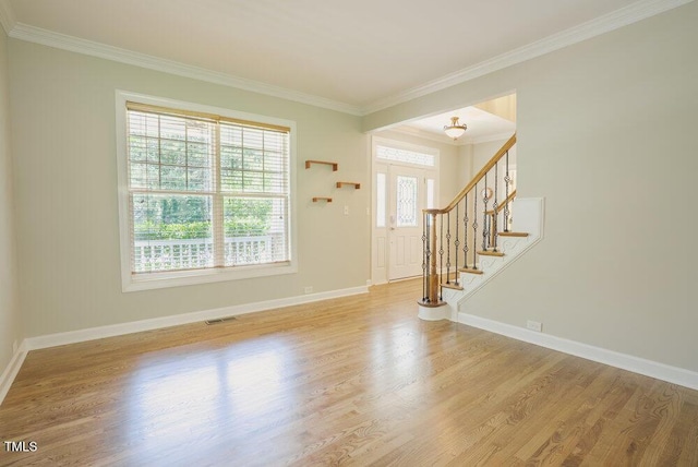 1005 Hidden River Ct, Raleigh, NC 27614 - foyer featuring ornamental molding, stairway, wood finished floors, and baseboards
